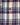 Close-up of the Coolidge Sherpa Lined Jacket pocket with a button, showcasing blue, white, maroon, and yellow plaid stripes.