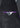 Closeup of the Glasgow Velvet Stretch Sport Coat pocket, featuring a purple trim, a triangular patterned fabric detail, and a black button sewn over the pattern.