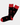 The Black Lips Sock is a pair of cotton socks, size 8-12, in black with red toes, heels, and cuffs, decorated with a playful pattern of red lips showing white teeth.