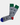 The Grey E-Gamer Sock features gray cotton with green cuffs, one blue toe, one red toe, and a video game controller pattern. Fits sizes 8-12. Made in Turkey.