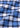 Introducing the Norman Button Down: crafted from blue, black, and white plaid fabric with a soft, slightly wrinkled texture and subtle diagonal creases. This timeless shirt captures classic European style, making it the perfect choice for elevating men’s fashion.