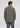A person seen from the back wearing a grey and black houndstooth plaid Split Rock Sherpa Jacket.