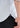 Close-up of a person’s hand in their black pants pocket, wearing the Turk Button Down—a white, subtly striped men’s dress shirt crafted from premium European cotton. A purple waistband with a small circular logo peeks out from under the shirt.