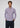 A man with short curly hair wears the Zerkel Stretch Button Down in purple with thin stripes and dark pants, standing against a plain light gray background with his hands in his pockets.