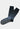 The Graduated Dot Sock features a geometric multicolored dot pattern on black, with gray soles and black cuffs, sized to fit men's 8-12.